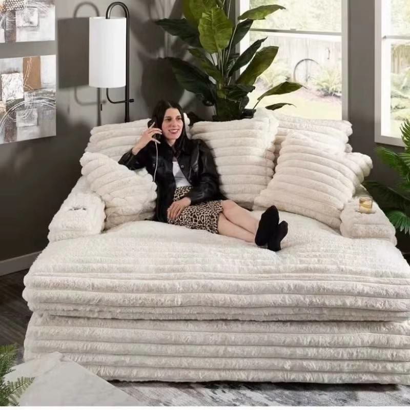 Cream channel-tufted sofa bed from Jerry's